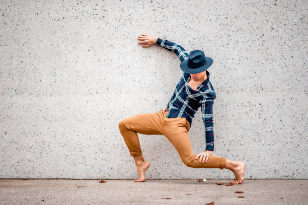 istock Male artist posing by the concrete wall 1264110881
