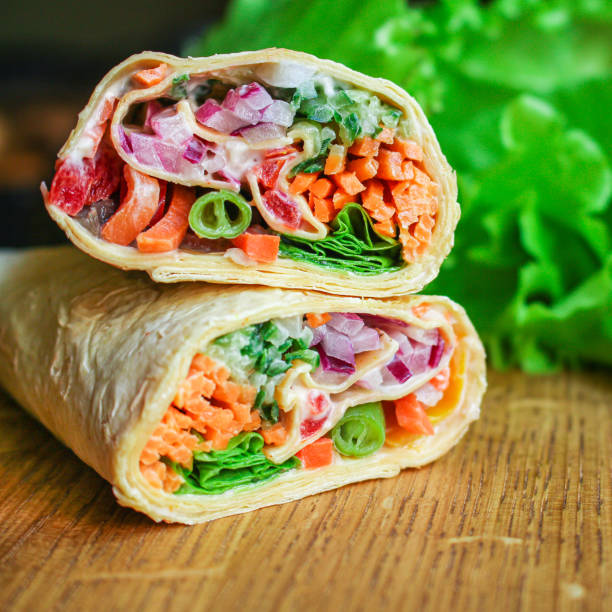 tortilla burrito wrap vegetables stuffing lavash vegetarian pita bread Menu concept Takeaway serving size fast food background top view copy space