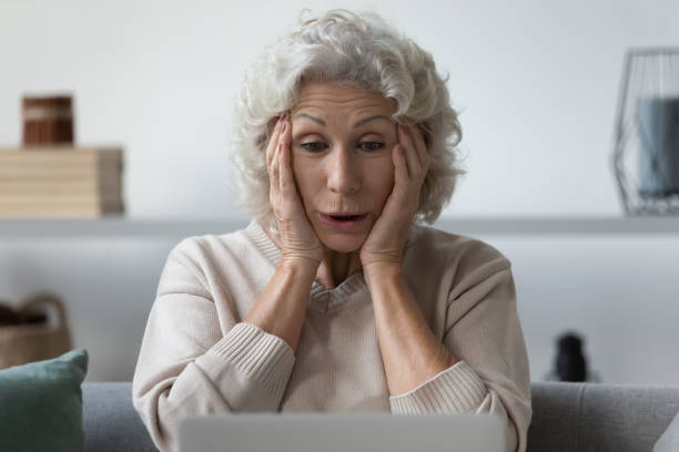 istock Grandmother grab her head felt shock what saw on internet 1264113467