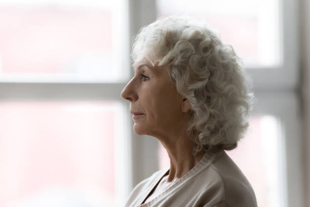 istock Side profile view face of elderly serious grey haired woman 1264113486