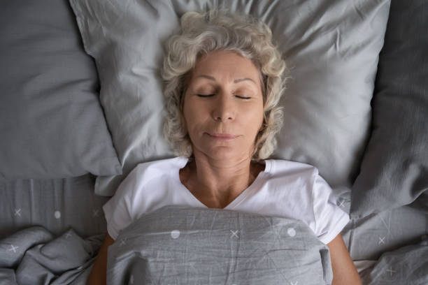 istock Top view elderly woman sleeping in the bed 1264113548
