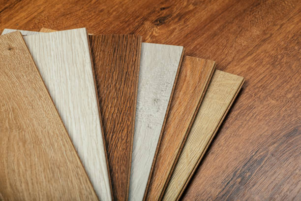 istock Laminate background. Samples of laminate or parquet with a pattern and wood texture for flooring and interior design. Production of wooden floors 1264114115