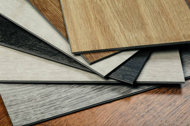 istock Laminate background. Samples of laminate or parquet with a pattern and wood texture for flooring and interior design. Production of wooden floors 1264114126