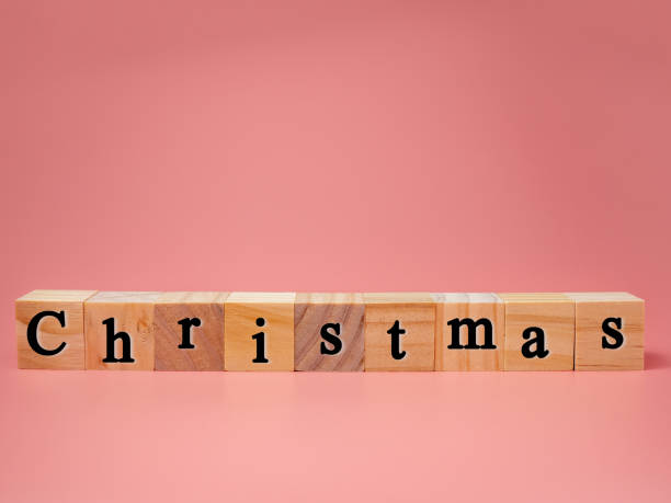 istock Christmas concept with wooden blocks on pink background. copy space. 1264114186