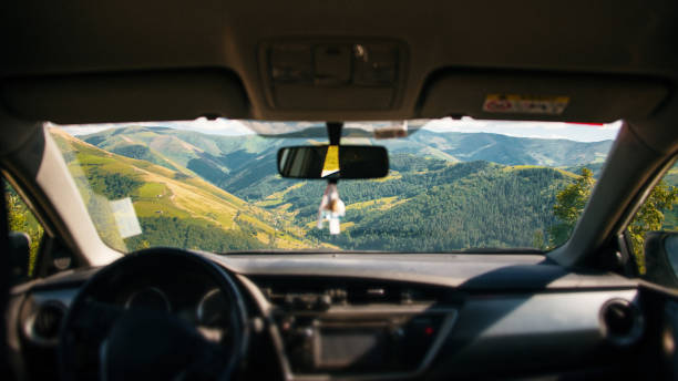 Beautiful mountain landscape as seen from inside a car A beautiful mountain landscape as seen from inside a car. Puerto de La Braguía in Cantabria, Spain. car point of view stock pictures, royalty-free photos & images