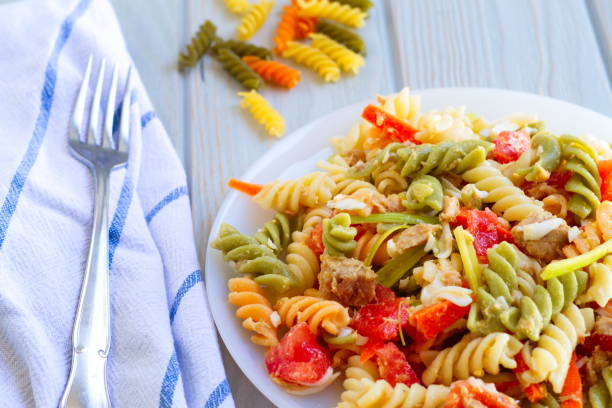 istock Delicious and summery pasta salad with vegetables 1264118976
