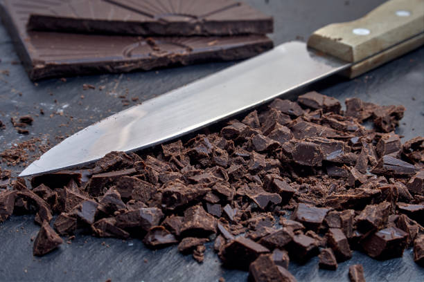 istock Chocolate cut with a knife, on a slate base. 1264122043