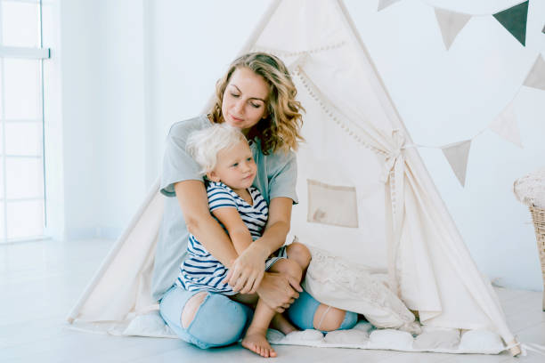 istock Mom and daughter in a wigwam 1264126086
