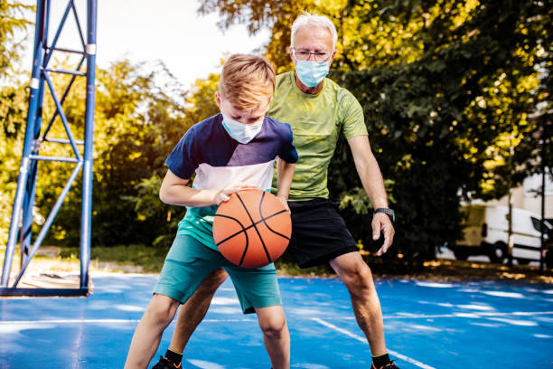 istock Playing basketball with grandfather during pandemic 1264127773