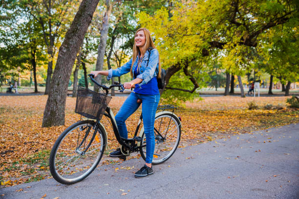istock Woman on a bicycle in the park 1264129912