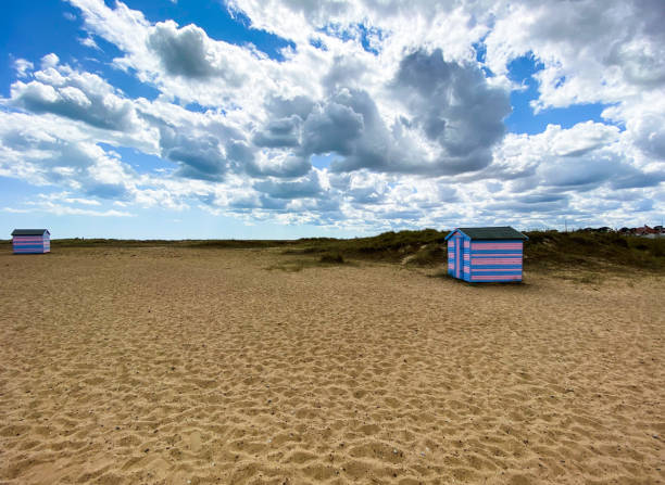 istock North sea beach cabins in a cold summer day 1264129925