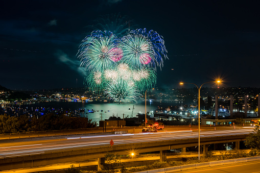 Seattle, USA - July 4th, 2019: Fireworks over lake union as WSDOT and the Highway Patrol shut down exits into downtown just after 10:00pm.
