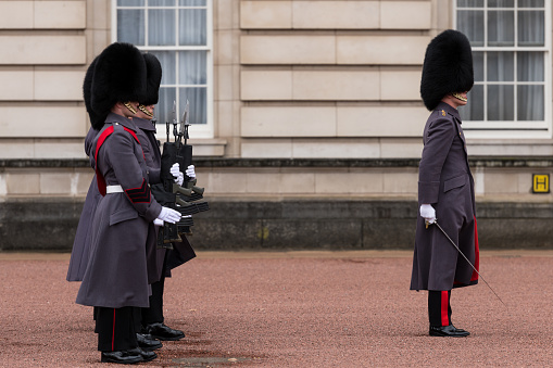 London, UK - Mar 15, 2019: The Coldstream Guard at Buckingham palace mid day during the iconic changing of the guards ceremony.