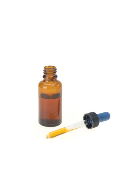 istock Dropper on white background, Oil from a pipette, essential oil bottle 1264131177
