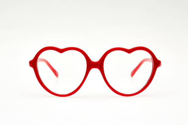 istock Red heart shaped eyeglasses isolated on white background 1264134306