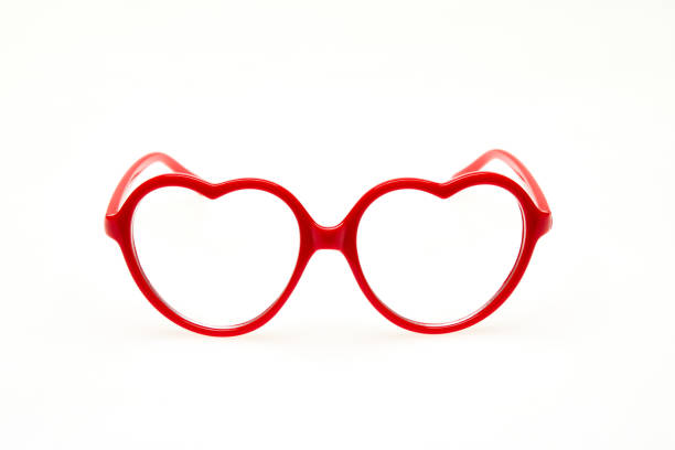 istock Red heart shaped eyeglasses isolated on white background 1264134628