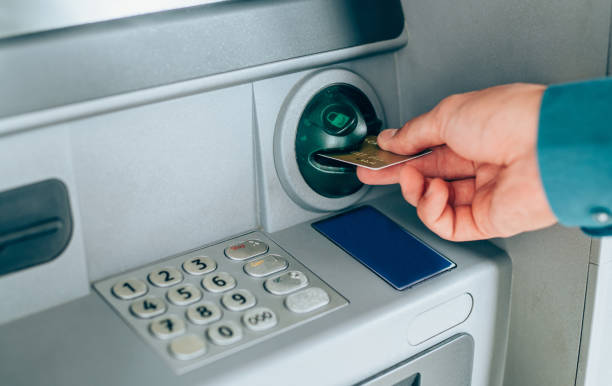 istock Man is withdrawing money from an ATM. 1264134860