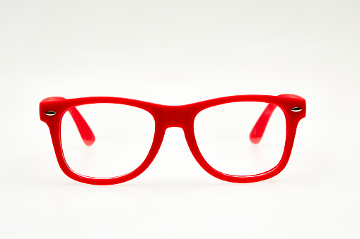 Red eyeglasses isolated on white background