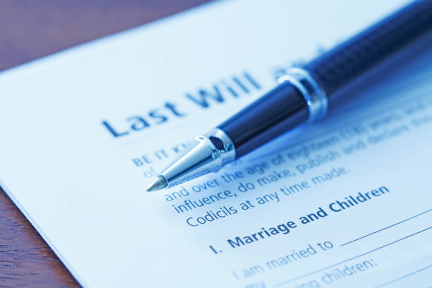 istock Ballpoint Pen Resting on Last Will And Testament 1264139384