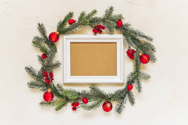 istock Christmas light background, fir branches wreath with red baubles and berries, beautiful frame and copy space for your text. 1264139418