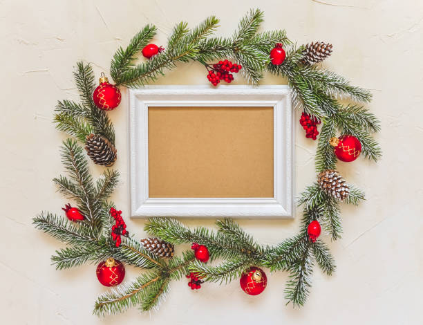 istock Christmas light background, fir branches wreath with red baubles and berries, beautiful frame and copy space for your text. 1264139548