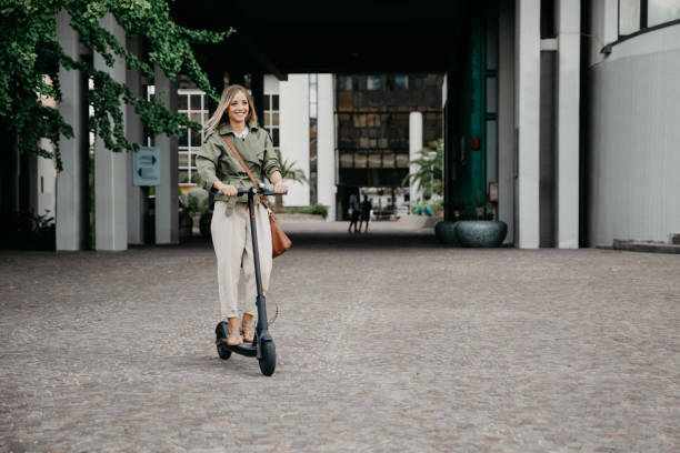 istock Green mobility in the city; woman commuting to work 1264139640