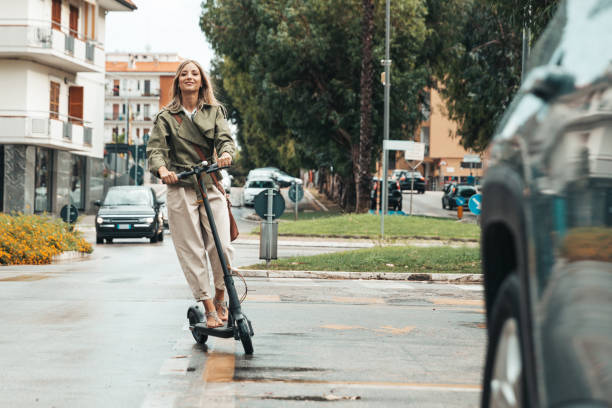 istock Green mobility in the city; woman commuting to work 1264139814