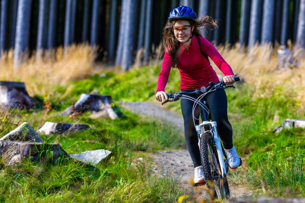 istock Girl riding bike on forest trails 1264141207