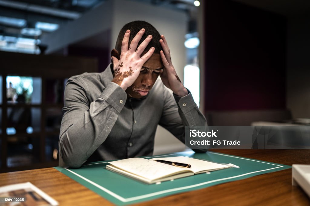 Worried and stressed student while studying or working University Student Stock Photo