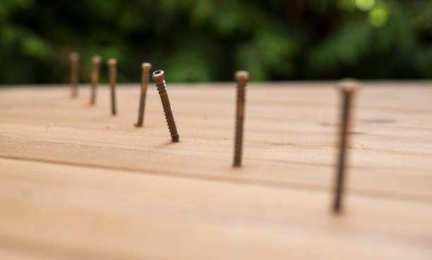 istock row of metal screws 1264142664