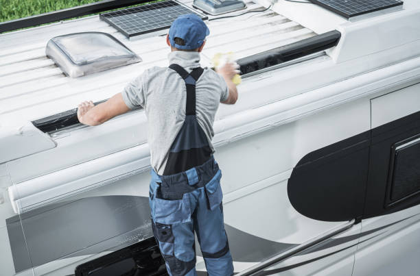 rv service worker cleaning camper van roof - rving imagens e fotografias de stock