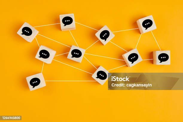 Concept Of Online Communication Or Social Networking Wooden Cubes With Speech Bubbles Linked To Each Other Stock Photo - Download Image Now