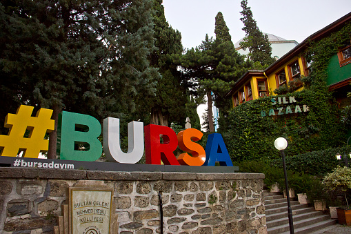 Bursa, Turkey - July 18, 2020: View of silk market near Green Mosque and Green mausoleum at bursa silk bazaar. Green Mosque (Turkish: Yesil Cami) is one of the most important landmark of Bursa. Green mausoleum was built in 14th century by ottomans in Bursa City. And there is çelebi mehmet's tomb who is 5th ottoman sultan.