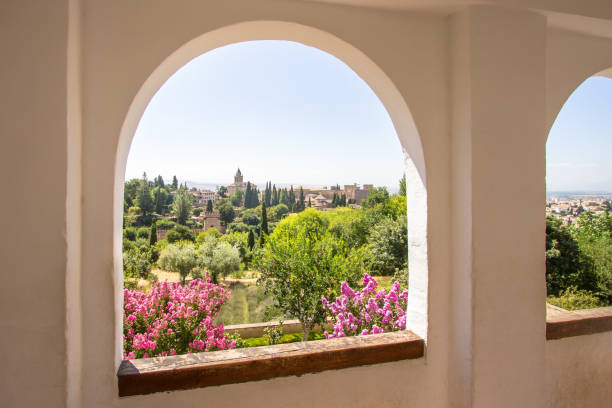 Stone arches in the world-famous garden of the Alhambra, Andalucia, Granada, Spain