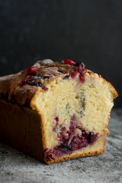 istock Loaf cake with red berries on the table 1264148794