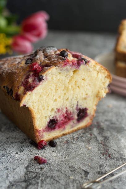 istock Loaf cake with red berries on the table 1264149606