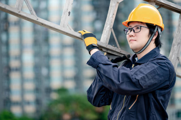 istock Maintenance worker man carrying aluminium ladder 1264151512