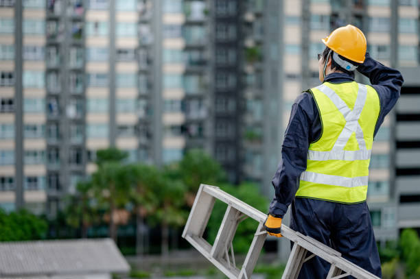 istock Maintenance worker man carrying aluminium ladder 1264151520