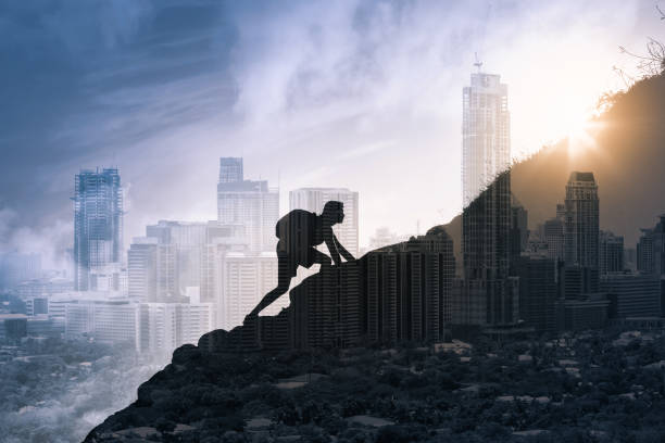 istock Man climbing up mountain. People goal setting and never giving up. 1264157143