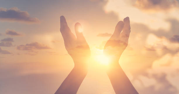 istock Worshiping hands up to the sky. 1264157239