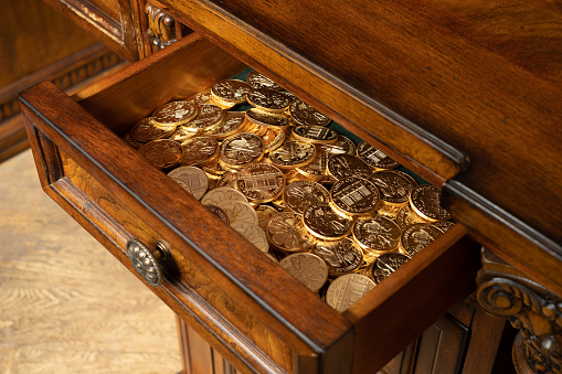 Austrian Philharmoniker pure gold coins hidden in old wooden drawer. Conservative investor's portfolio.