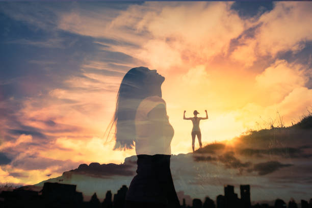 istock Strong young woman looking up to the sky. 1264157828