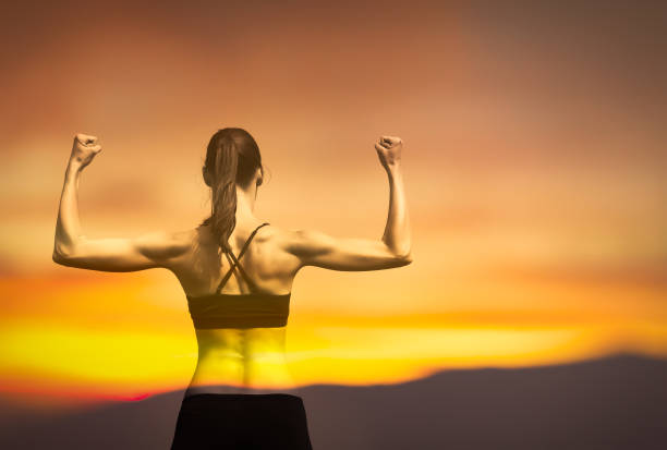 istock Strong muscular female flexing. 1264157868