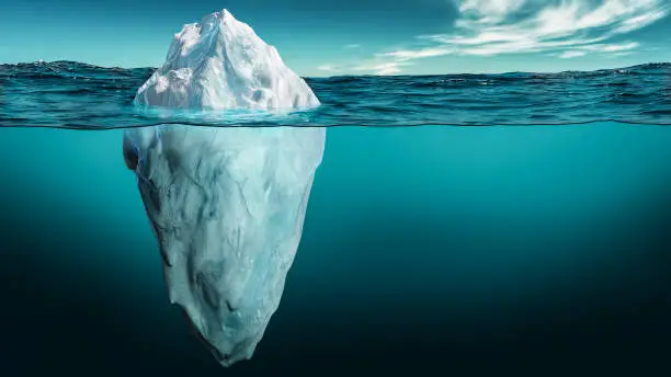 Photo of Iceberg with its visible and underwater or submerged parts floating in the ocean. 3D rendering illustration.