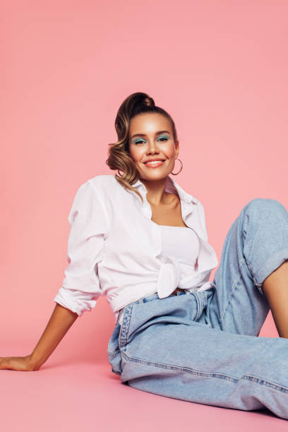 istock Girl dressed in 80s style sits on the floor at the studio 1264160503