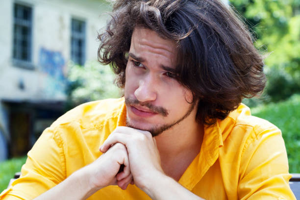 istock Portrait of a depressed young man 1264162761