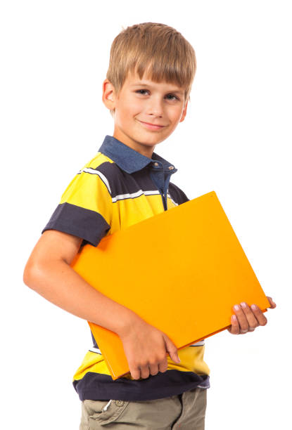 istock Schoolboy holding books 1264162794