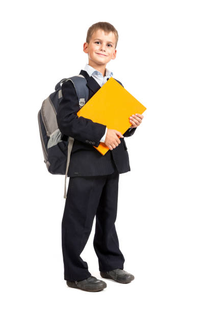istock Schoolboy holding books 1264162860