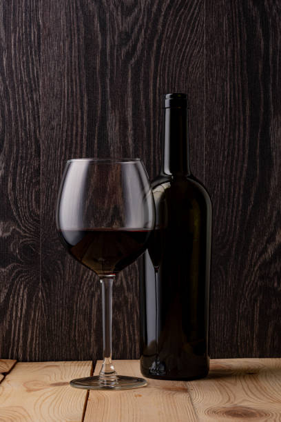 istock Wine bottle and a glass of wine. 1264163585