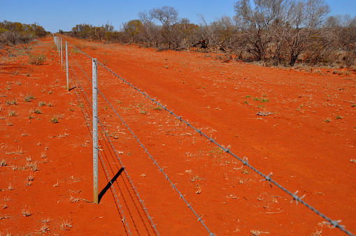 Horizontal image of arid red landscape. Near Exmouth, Western Australia, Australia July 2020.